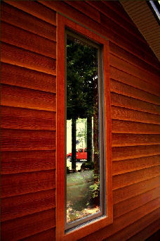 Andersen Casement Terratone Framed in Wood STained Fiber Cement Siding