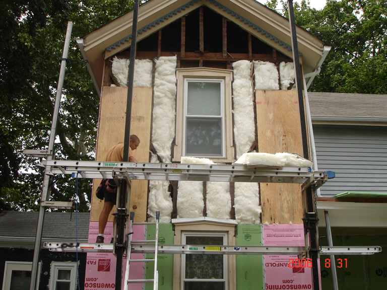 Insulation added to open wall cavities